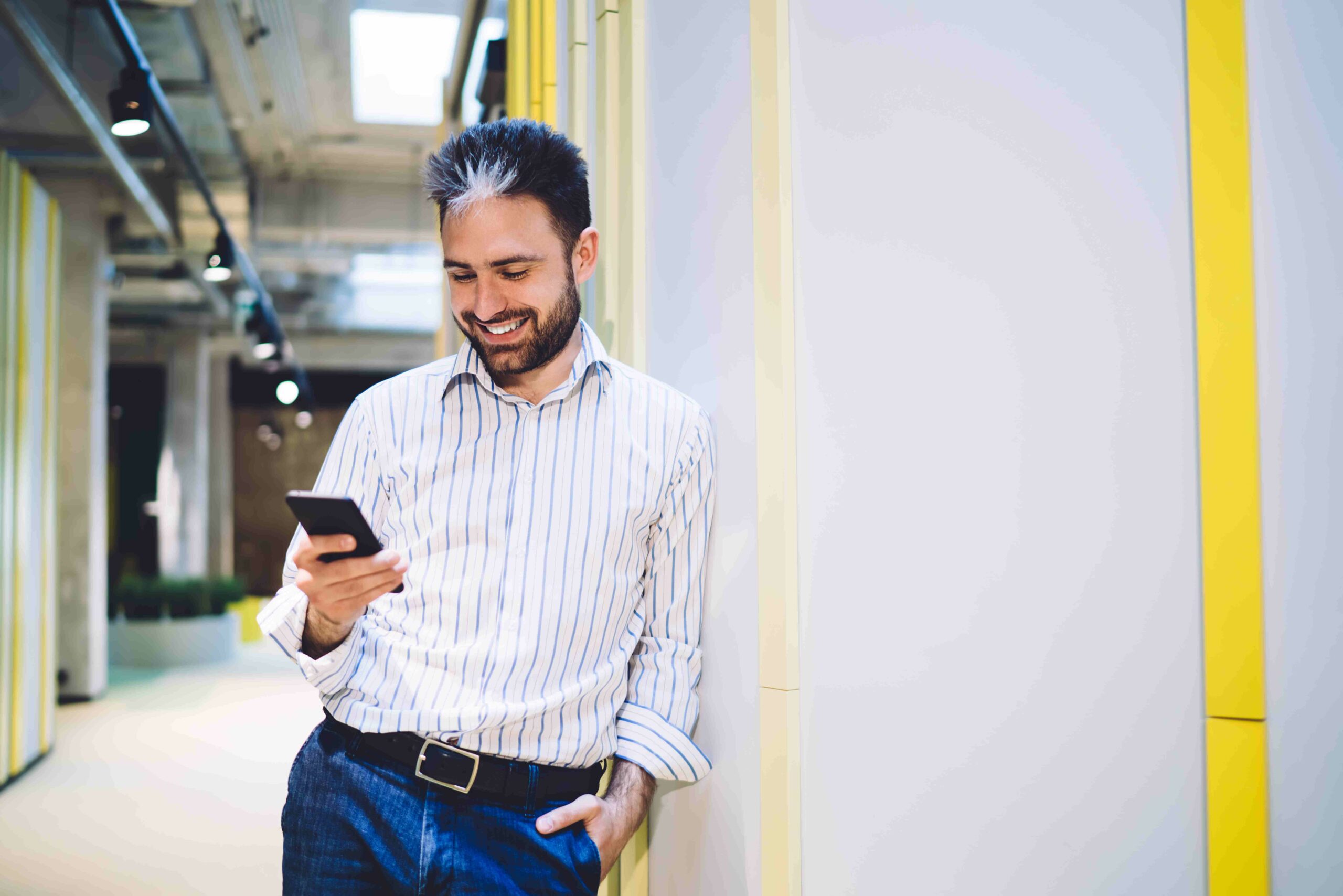 confident-handsome-young-man-browsing-smartphone-i-2025-03-25-11-26-30-utc_11zon